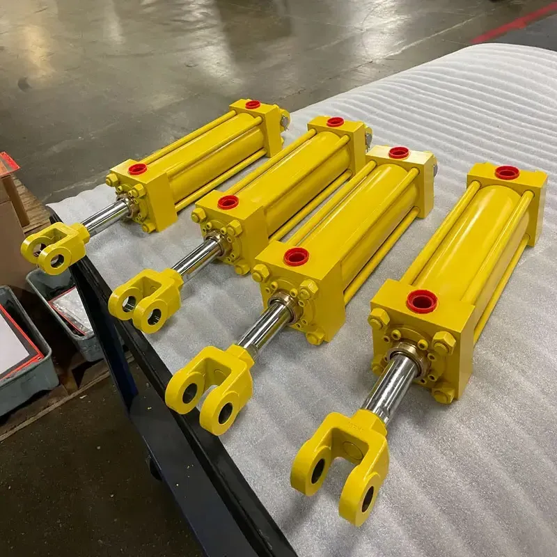 Four yellow tie rod cylinders